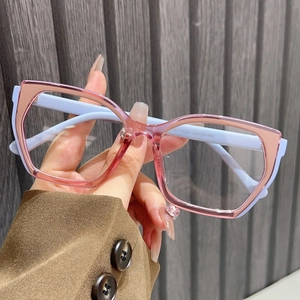 Detailed shot of TR90 large frame glasses featuring pink fronts and light blue temples