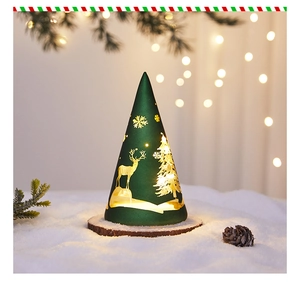 Detail of cone-shaped Christmas glass lamp with golden deer pattern on snow