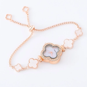 Detail of rose gold clover bracelet watch with mother-of-pearl dial and adjustable chain