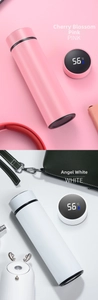 Close-up of smart LED temperature display on lids of pink and white vacuum flasks