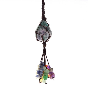Detailed view of handmade natural fluorite stone with colorful crystal beads and woven rope