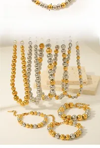 Detail of 10mm gold and silver beaded necklace with 40cm length and extension chain