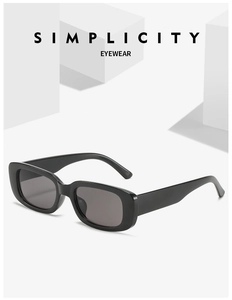 Detail of black rectangular sunglasses on a white geometric stand with simplicity text