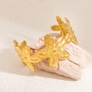 Elegant 18K gold-plated stainless steel cuff bracelet featuring large 3D relief flower motifs