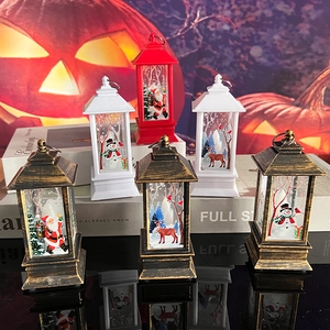 Detail of Christmas lantern decorations in bronze, red and white with festive patterns