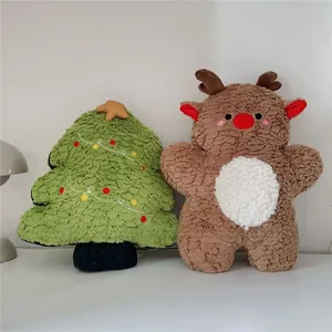 Close-up of plush Christmas tree and reindeer toy set with soft textured curly fabric