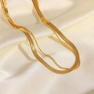 Double-layered 18K gold titanium steel anklet featuring snake and bead chain design