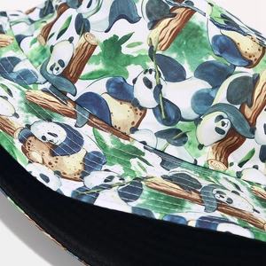 Close-up of panda and bamboo forest print on cotton twill reversible bucket hat