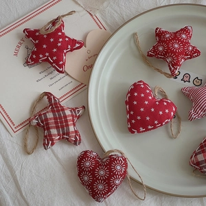 Festive fabric Christmas heart and star ornaments with twine loops and rustic textures
