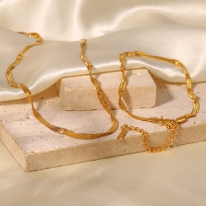 Close-up of 18K gold-plated stainless steel snake chain bracelet with lobster clasp