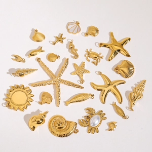 Detailed overhead view of golden marine charms like starfish, shells and sea horses
