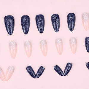 Almond press-on nails with blue marble glitter and pink gradient sparkle design