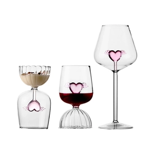 Pink winged heart glass cups set featuring wine goblet and dessert glass on white background