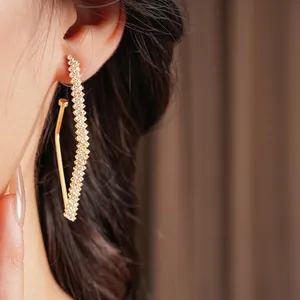 Sparkling geometric V-shape dangling earrings with gold finish and inlaid rhinestones
