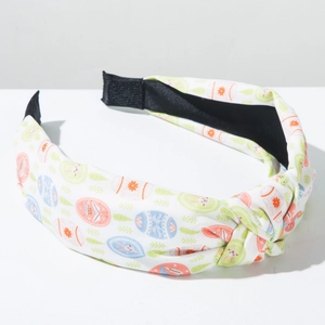 Close-up of knotted Easter headband featuring colorful eggs and rabbit fabric print