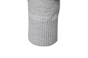 Detailed macro view of the grey knitted sweater cuff showing ribbed texture and stitching