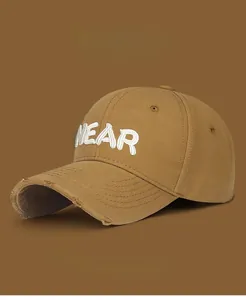Detail of embroidered NEAR logo and distressed brim on stylish baseball cap