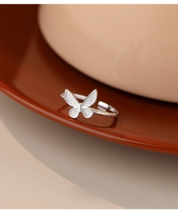 Detailed close-up of S925 silver butterfly ring showing fine textured wing patterns