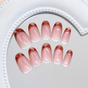 Cat eye and leopard print press-on nails with amber French tips on a pearl mirror base