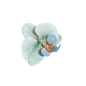 Floral hair clip with green orchid petals and a white pearl center for elegant styling
