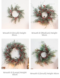 Detail showing different sizes of red berry Christmas wreaths with pine cones and needles