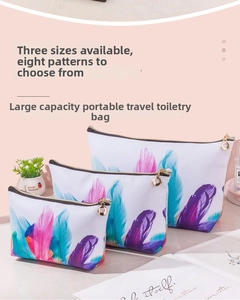Three-piece travel toiletry bag set with feather print and gold zipper details