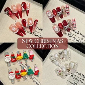 Handmade Christmas press-on nails set featuring Santa Claus, snowflakes and festive glitter