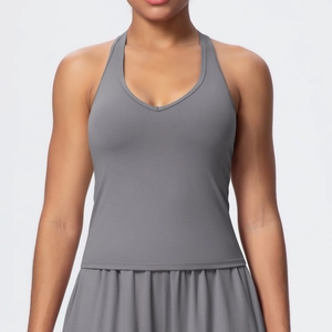 Detail of dark grey V-neck yoga tank top featuring elastic fabric for gym workout