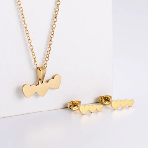 Gold stainless steel jewelry set featuring triple heart pendant necklace and stud earrings