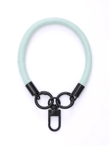 Close-up of light blue leather wrist strap with matte black metal hook and ring