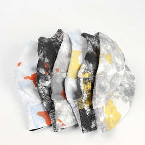 Macro shot showing diverse colorful tie-dye canvas bucket hats in street style
