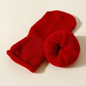 Detail of red thermal terry lining inside thick winter socks for babies and toddlers