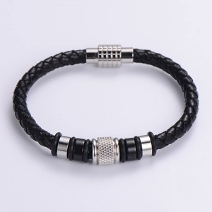 Top-down view of black braided leather bracelet with stainless steel metal beads