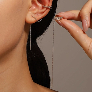 Detail of rose gold long chain tassel ear cuff set with sparkling zircon stones