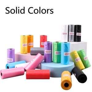 Biodegradable dog poop bags in multiple colors displayed on decorative foam blocks