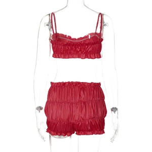 Detailed back view of red satin two-piece lingerie set with ruffle trim and elastic shorts