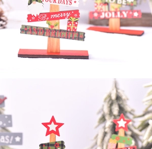 Detail of wooden Christmas tabletop decor with red green festive patterns and typography