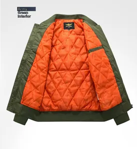 Detail of army green bomber jacket featuring orange quilted lining and ribbed collar