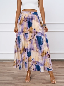 Detailed view of abstract oil painting print and fine pleats on an A-line midi skirt