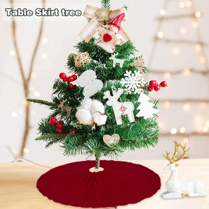Red knitted Christmas tree skirt with festive textures under a decorated tree