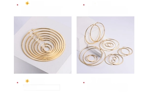 Detailed view of polished gold hoop earrings in various sizes on white geometric blocks