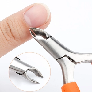 Stainless steel cuticle nipper with orange silicone handle trimming fingernail skin