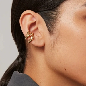 Elegant gold titanium steel ear cuff with a twisted streamlined design for non-pierced ears