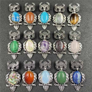 Collection of owl crystal pendants with fifteen varied gemstones and vintage silver frames