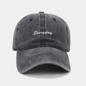 Detail of white Everyday embroidery on charcoal washed cotton baseball cap with curved brim