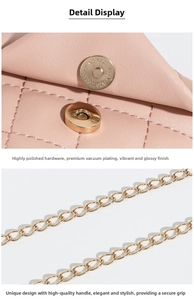 Detailed macro of pink quilted faux leather bag with gold metal chain and magnetic snap