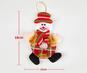 Close-up of plush snowman Christmas hanging ornament with Merry Christmas embroidery