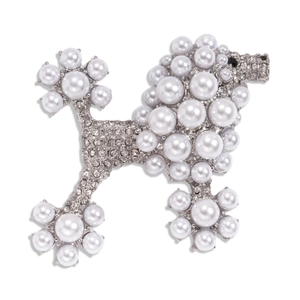 Elegant silver poodle brooch with white pearls and sparkling rhinestones on white base