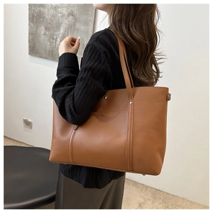 Brown large capacity PU leather tote bag with exterior pocket and magnetic buckle