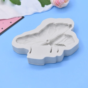 Gray silicone mold featuring realistic lotus leaf texture and veins for fondant cakes